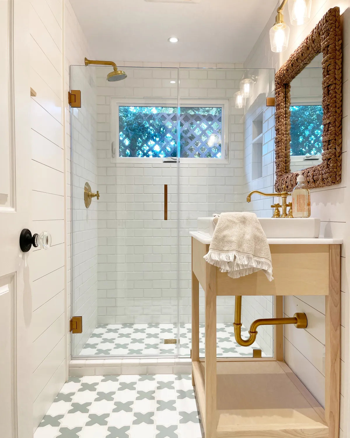 2021 IMG HI res residential web soicial usage Design Stephanie feinerman design Photo bathroom floor star and cross mini sea glass calcite shower wall 3x6 calcite FC400975 1