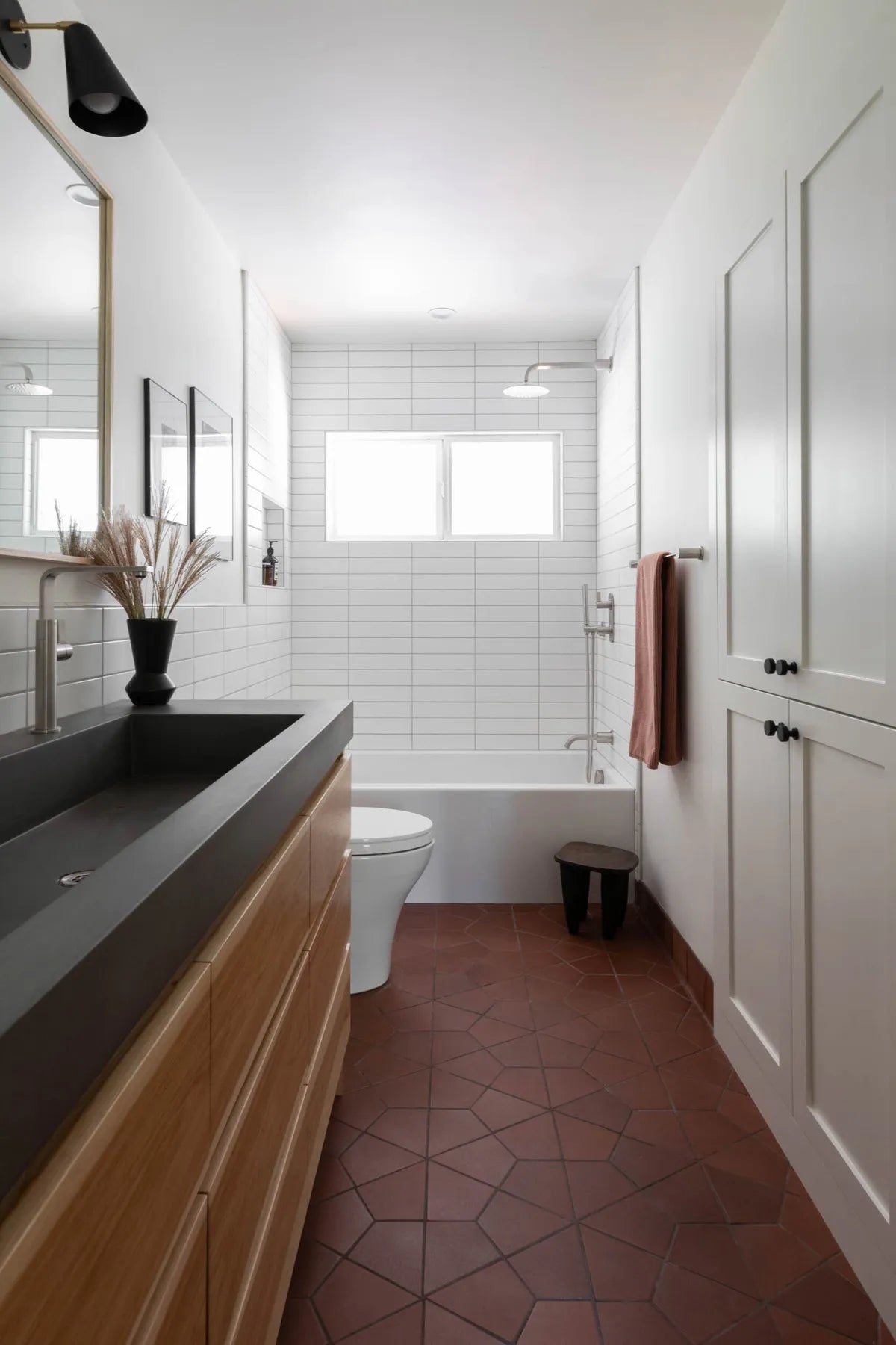 2021 IMG Lo Res residential design Kate Design photo lauren andersen bathroom calcite 3x12 bullnose trim antique hexite 4x6 round top cove base FC326154 FC380542 1