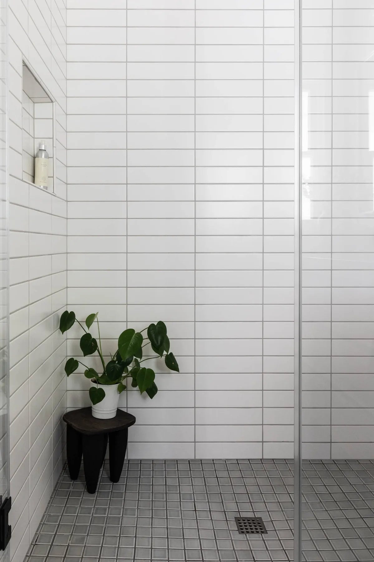 2021 IMG Lo Res residential design Kate Design photo lauren andersen bathroom calcite 3x12 bullnose trim overcast 2x2 FC326154 FC380542 3