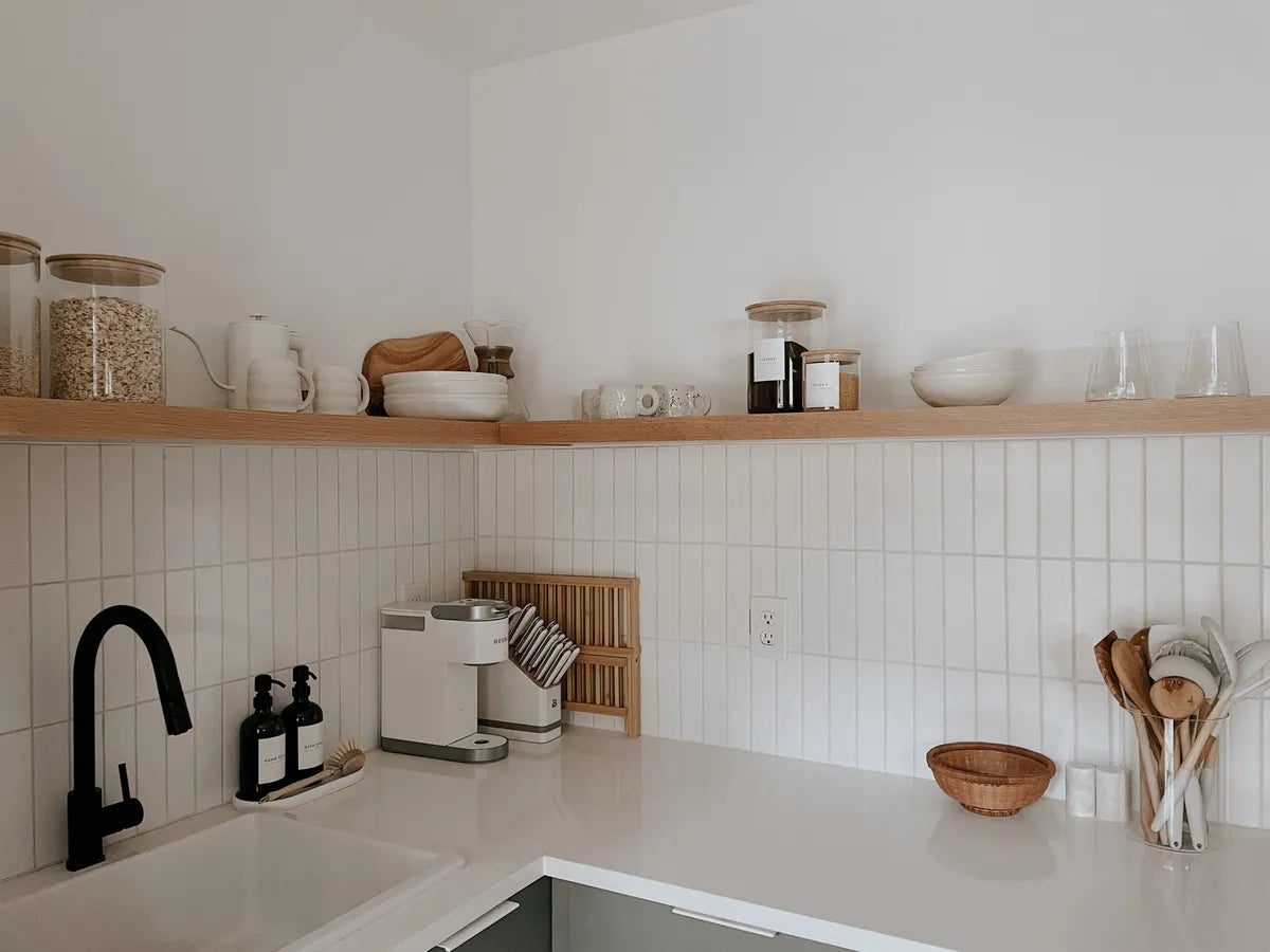 2021 IMG hi res residential influencer designer Jenna Marlar Photo Cozy happy home kitchen 2x8 calcite Quick ship verticle straight set grout beige FC477487 2