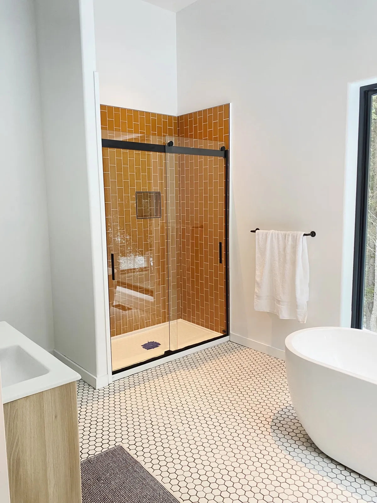 2022 img hi res influencer design photo Theron humphrey bathroom floor 222 hexagon halite shower 3x6 falcon matte niche FC 388392 FC 388396 1