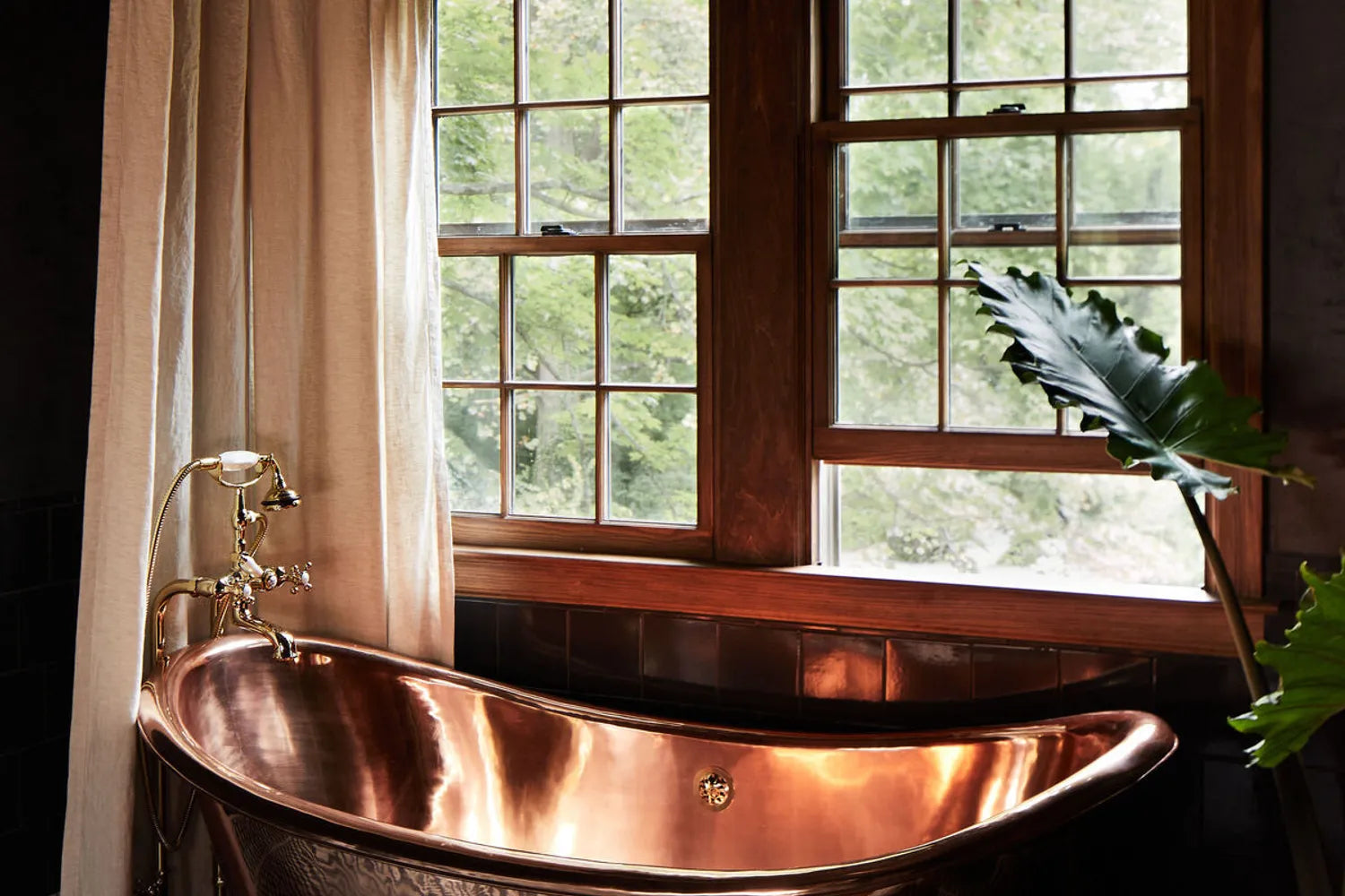 Modern Victorian Bathroom Design Ideas To Borrow Black and white checkered mosaic tile floor with a copper clawfoot tub by a window