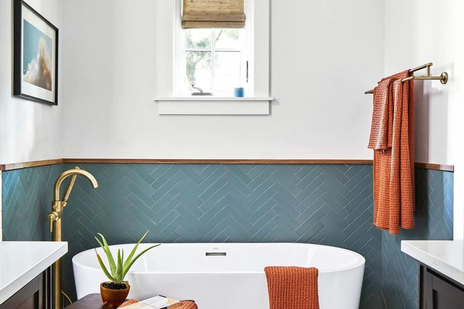 Blue bathroom tile modern herringbone soaking tub wainscot surround