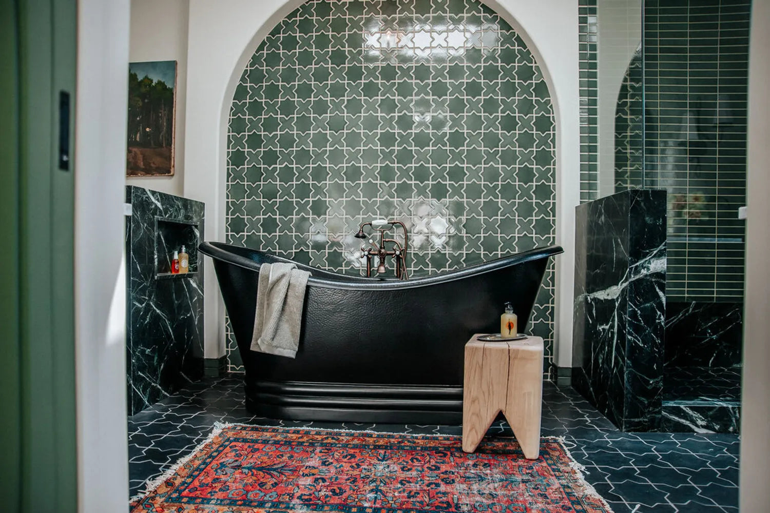 Dark green tile star and cross bathroom