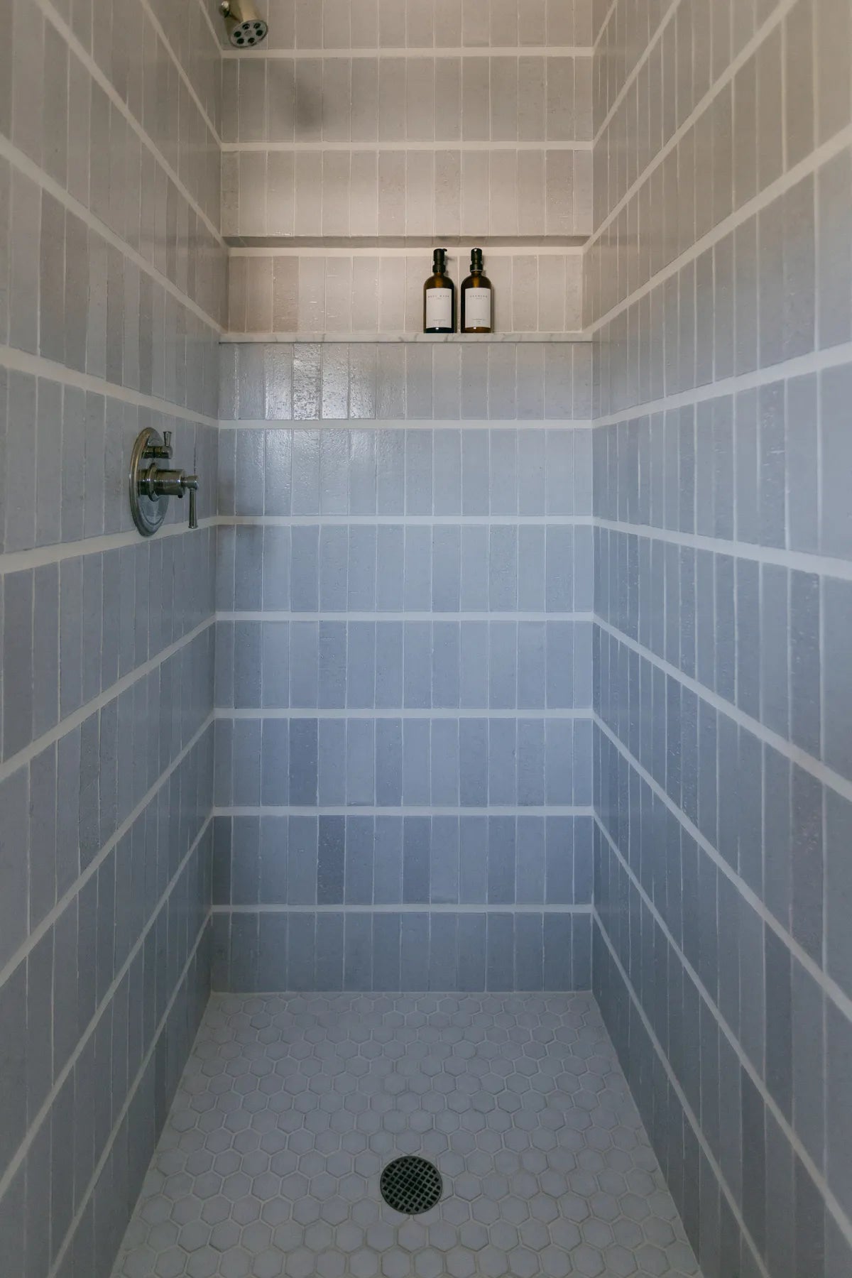 2019 IMG photo hi res influencer Taylor and Taylor photo tiffany studio Bathroom thin brick Elk white grout verticle set shower 2 in sheeted hexagon daisy fc318013 FC318007 4
