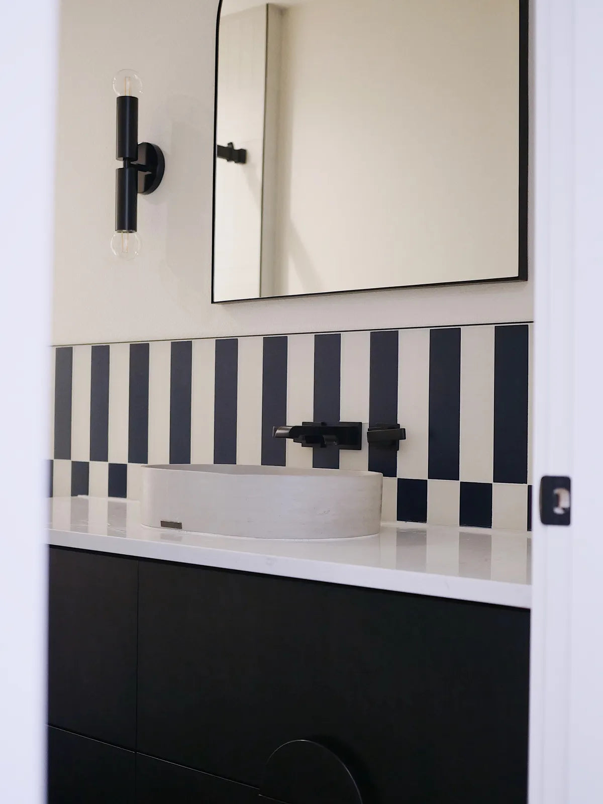 2021 IMG lo res residential design tiffany thompson duett interiors photo marni mervis bathroom backsplash floor quickship 3x12 glass barn swallow Dove matte verticle offset set large star and cross Navy blue 3