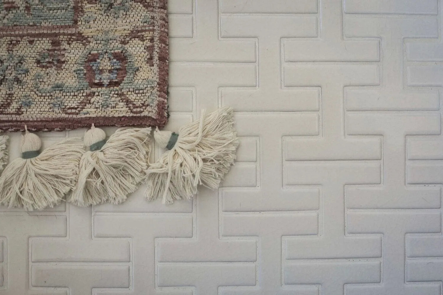 How To Choose Your Floor Tile Detail Shot of H Shaped Chaine Homme Bathroom Tile Floor