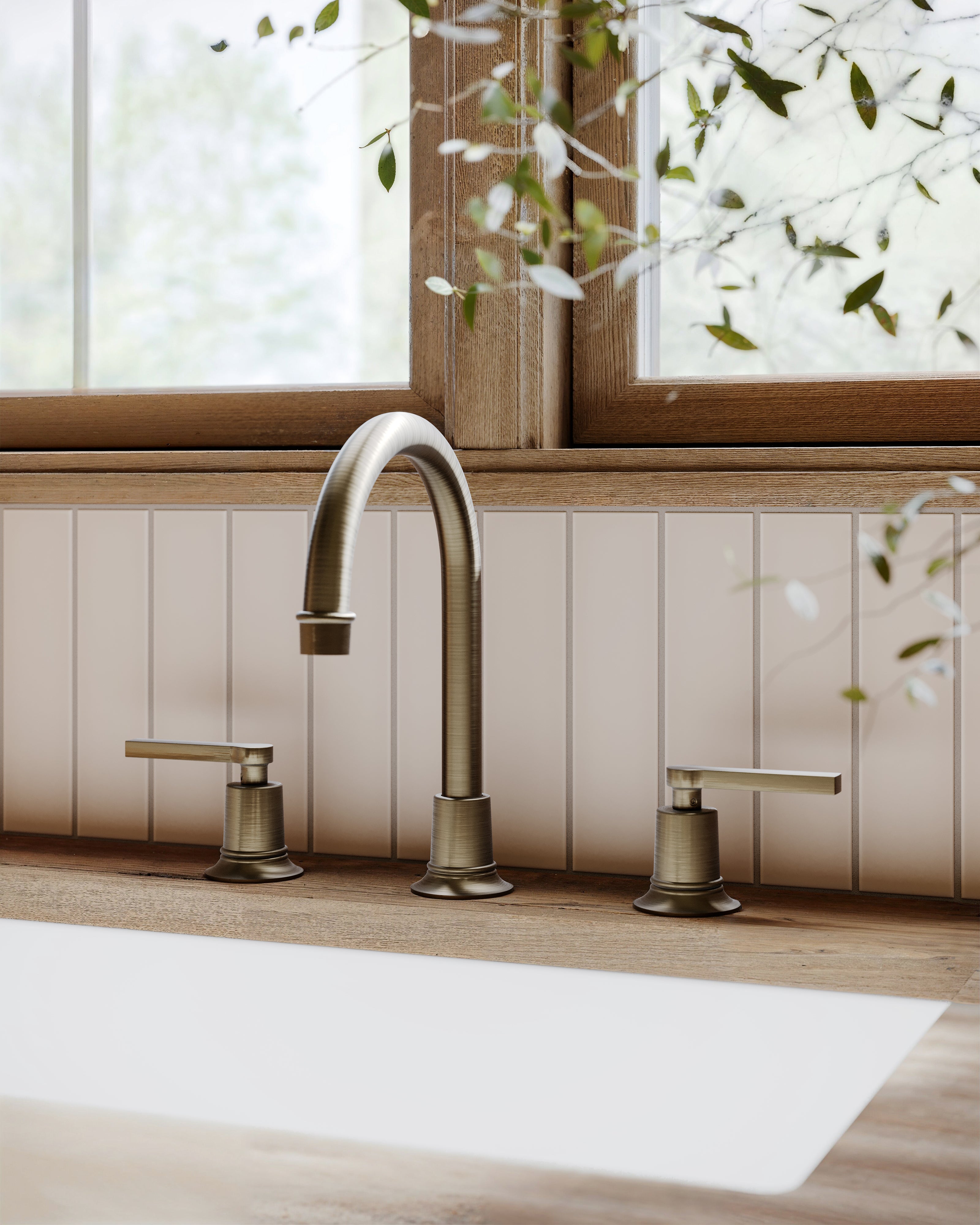 Emerson Two Handle Deck Mount Gooseneck Lavatory Faucet with Classic Lever Handles in Antique Brass