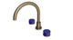 Foundry Two Handle Deck Mount Gooseneck Bath Trim with Groove Ceramic Knob Handles in Antique Brass