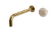Foundry One Handle Wall Mount 7.5" Lavatory Faucet with Pebble Ceramic Knob Handle in Uncoated Polished Brass