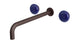 Foundry Two Handle Wall Mount 12" Lavatory Faucet with Pebble Ceramic Knob Handles in Architectural Copper