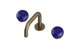 Foundry Two Handle Deck Mount Squaretop Lavatory Faucet with Pebble Ceramic Knob Handles in Antique Brass