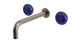 Foundry Two Handle Wall Mount 7.5" Lavatory Faucet with Pebble Ceramic Knob Handles in Antique Nickel