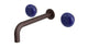 Foundry Two Handle Wall Mount 7.5" Lavatory Faucet with Pebble Ceramic Knob Handles in Architectural Copper