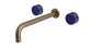 Foundry Two Handle Wall Mount 10" Lavatory Faucet with Groove Ceramic Knob Handles in Antique Brass