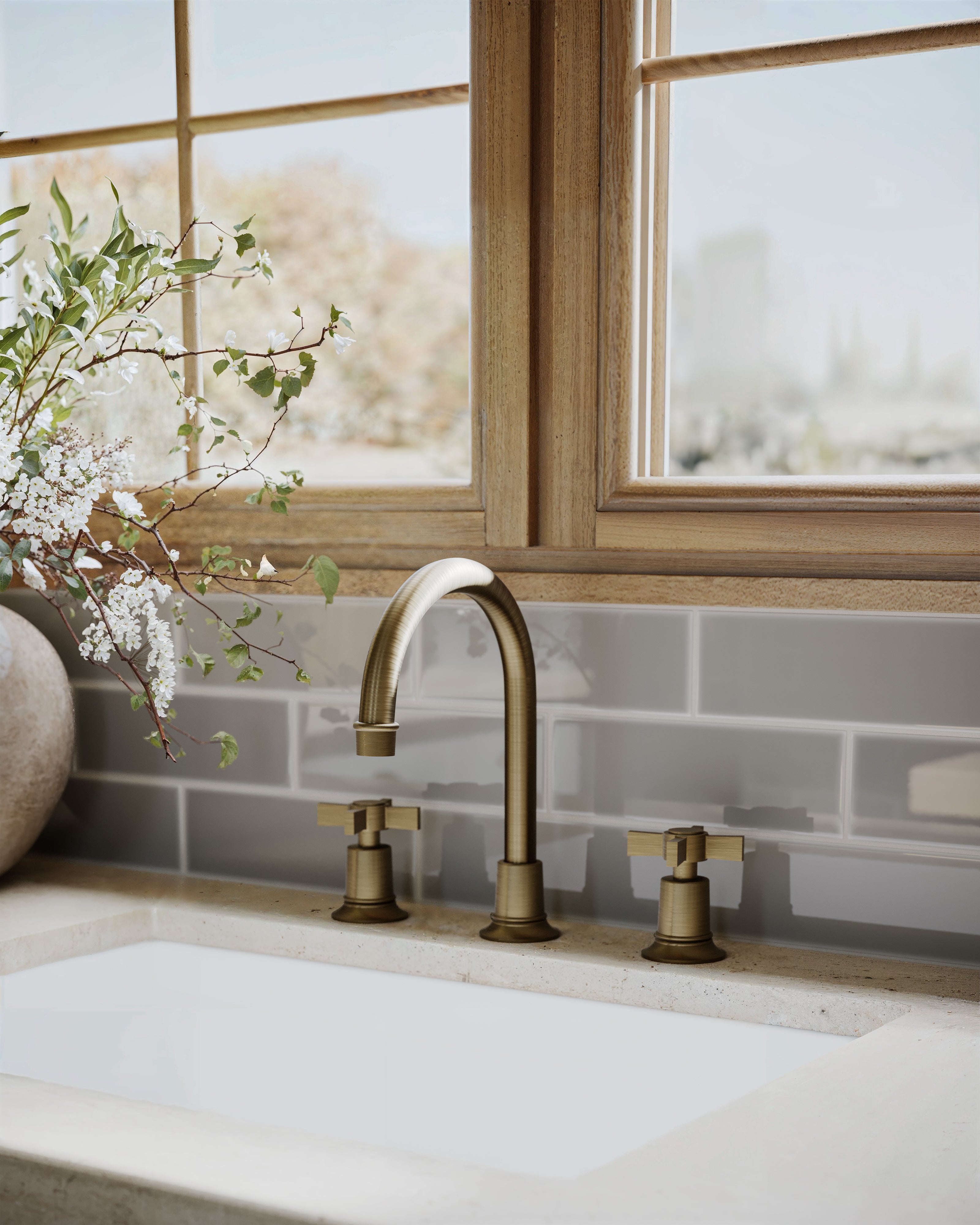 Emerson Two Handle Deck Mount Gooseneck Lavatory Faucet with Defined Cross Handles in Antique Brass